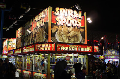 Spiral Spuds food booth on the CNE Midway at night