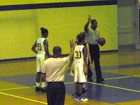 Alex Covington (21) and Vernessa Brown (30) prepare to rebound