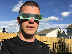 front view eclipse glasses over regular glasses