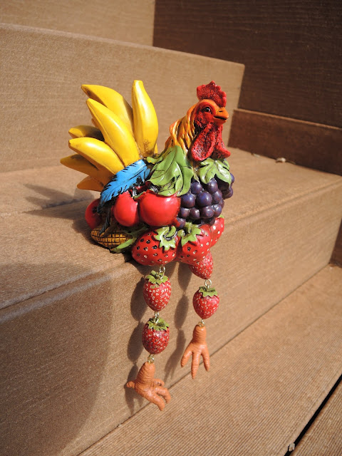 Frooster the fruit rooster with a twinkle in his eye.