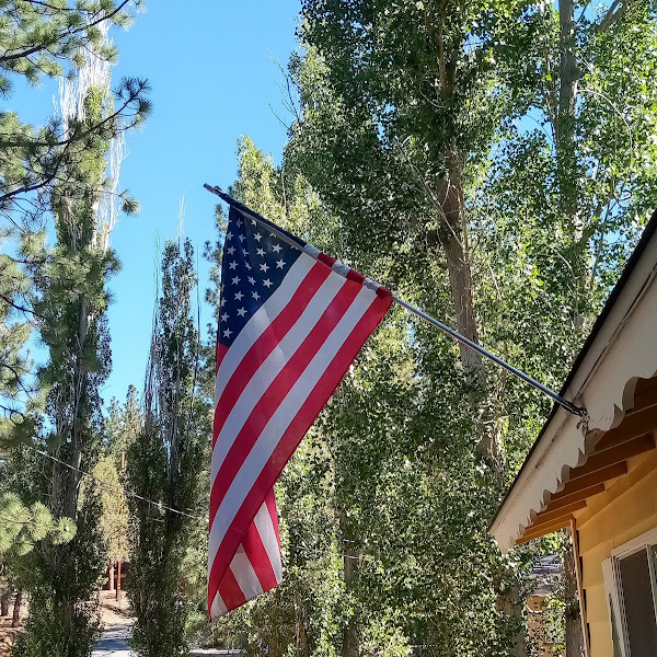 July 4th USA flag over porch
