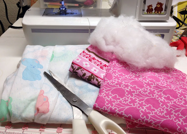 fabric, scissors and sewing machine for DIY pillow