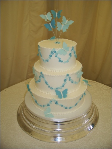Picture of 3 Tier White Wedding Cake with Blue Butterflies