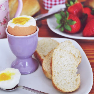 Breakfast with eggs and strawberries