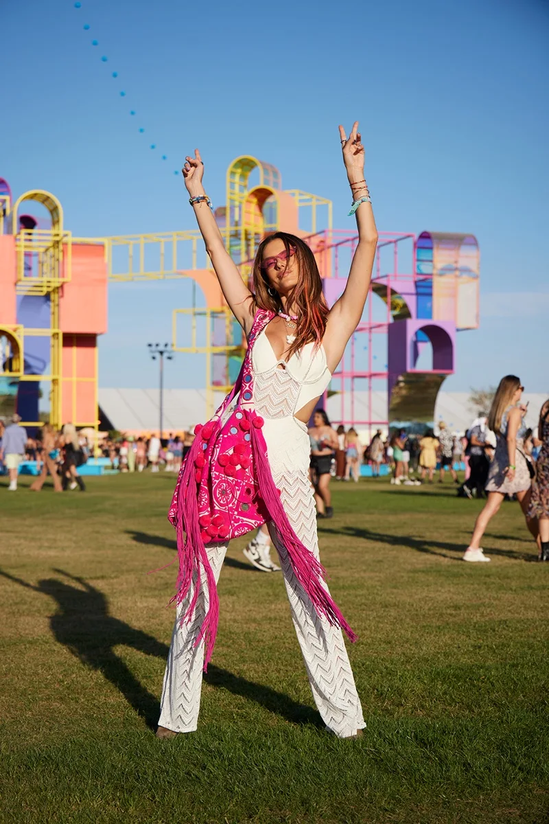 Posing at Coachella 2022 Weekend One, Alessandra Ambrosio models PatBOxAlessandra jumpsuit