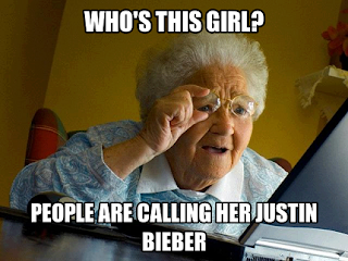 an old lady looking curiously to a book and saying justin bieber is a lady