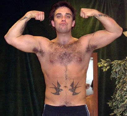 Robbie has a bunch tattoos on him including a lion birds musical notes