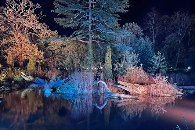 Crystal Palace dinosaurs lit up at night