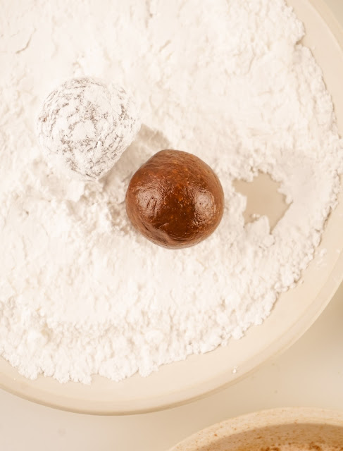 Rum Balls bring rolled in powdered sugar.