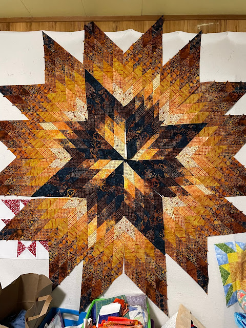 lone star quilt being laid out on design wall