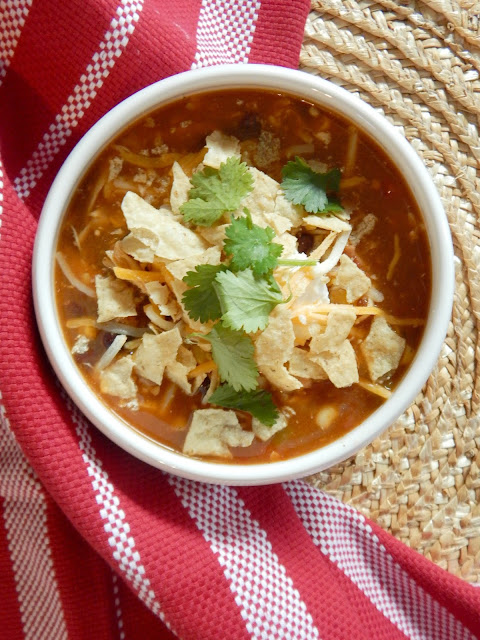 Instant Pot Chicken Enchilada Soup....an easy, quick meal in your Instant Pot or on your stove-top.  All the flavors of an enchilada in a bowl. (sweetandsavoryeats.com)
