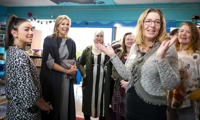 Queen Maxima wore gray top trousers suit by Natan and a gray wool cashmere cape by Natan