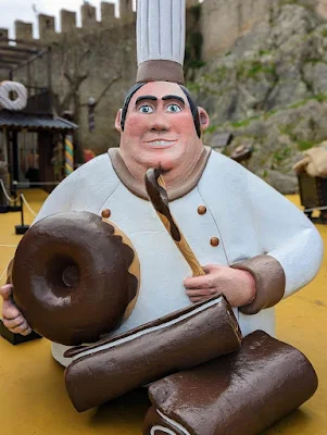 Sculpture of a fat chef with chocolate desserts at the Obidos Chocolate Festival