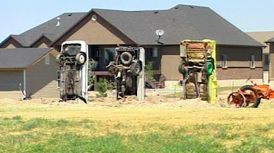 Redneck Stonehenge Car Fence from acros the street