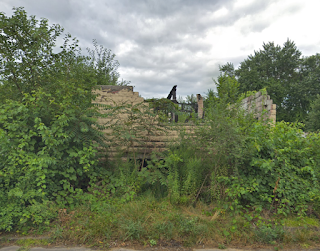 Gershom School in 2018 after the arson. Notice how the roofs and windows are missing.