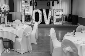 giant floral love letters and wedding set up