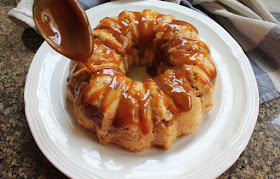 Food Lust People Love: Tart apple, sticky toffee and vanilla custard filled bread come together in this toffee apple bread pudding Bundt to create a dessert that is way more than the sum of its parts.