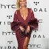    Photos: Beyonce shows off cleavage in plunging dress at Tidal X event  