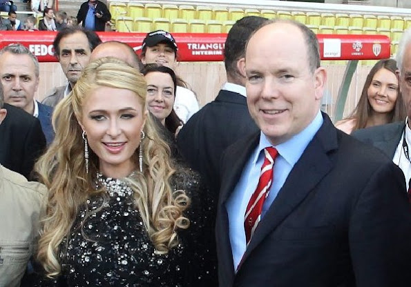 Prince Albert II of Monaco chats to Paris Hilton during the 22nd World Stars football match at the Stade Louis II in Monaco