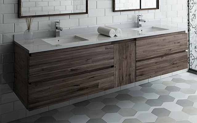 Sleek wood floating vanity in a gray and white tiled bathroom.