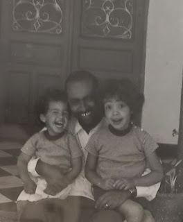 My father with my sister and I