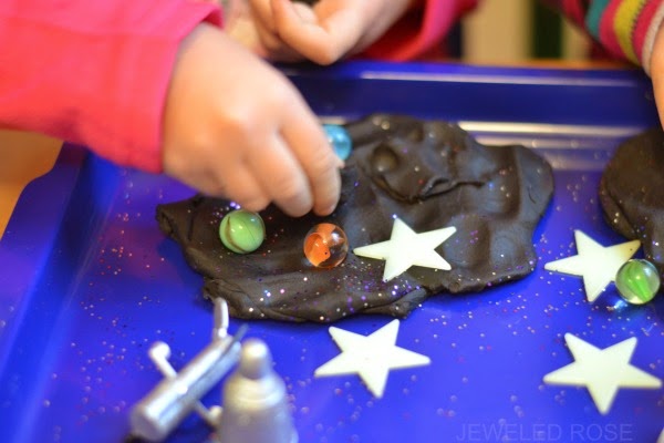 GALAXY DOUGH is super smooth, ultra sparkly, & really stretchy.  This no cook recipe takes seconds to make & is so FUN!  My kids played four hours!