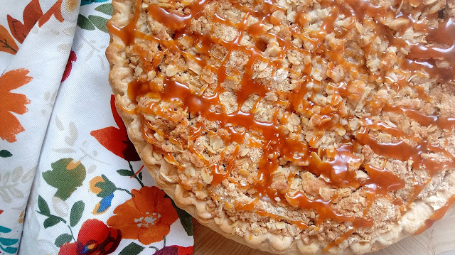 Easy Sour Cream Crumble Pie topped with a drizzle of salted caramel