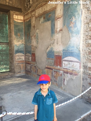 Child in front of villa in Pompeii