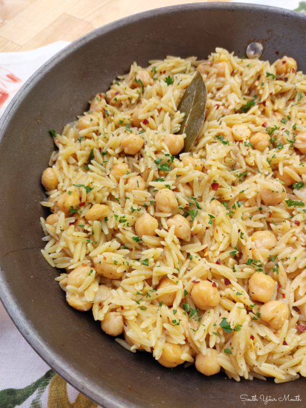 Spicy Chickpeas with Orzo! A Mediterranean inspired recipe with chickpeas (garbanzo beans), orzo and layers of spices and mild heat that doubles as the perfect side or a meatless main dish.
