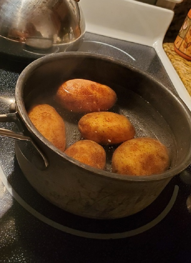 this is a pot of white potatoes boiling for making Colcannon potatoes for St. Patrick's Day meal