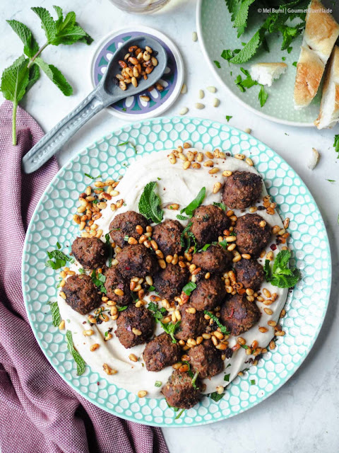 Spicy herb meatballs on a cool bean puree. An oriental-inspired favorite meal for the summer.