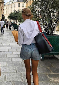 A Stylish Way to Wear Cut-Off Denim Shorts — Amalie Moosgaard Neilsen in Summer Outfit on Instagram White Button-Down Shirt, Cut-Off Jean Shorts, Gold Jewelry, and Celine Tote Bag