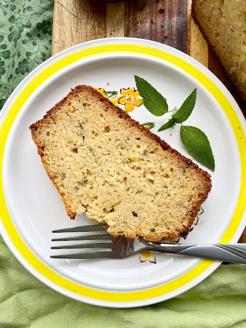 Slice of pineapple sage pound cake on a serving plate.