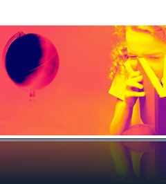 Young female student peeking in a book with a globe in the background uid
