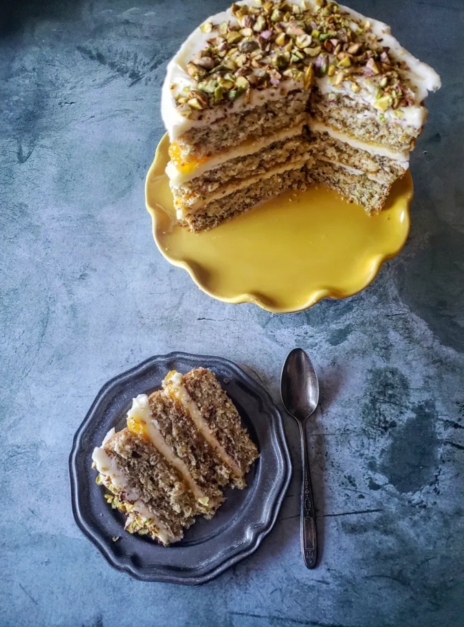 slice of cake on a plate with a spoon