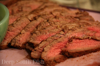 A beef broth, marinated flank steak, with Creole mustard, balsamic vinegar and herbs, prepared in the classic London Broil method, with a quick sear on a hot grill and sliced at an angle, against the grain, for a full flavored tender steak.