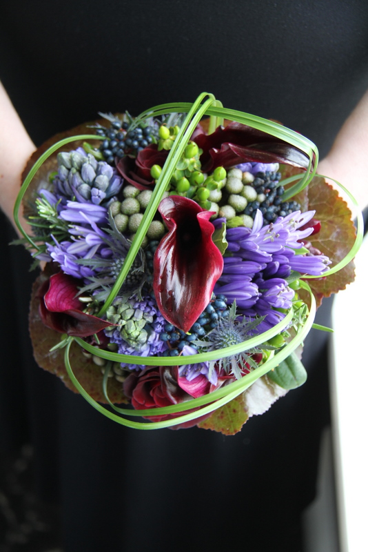 A tall magnificent Martini Vase Table design in complimenting Blue Purple 