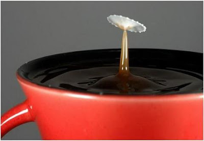 super slow motion picture of cream drops to coffee 14
