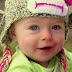 Smiling Baby in Happy Mood with Blue Eyes
