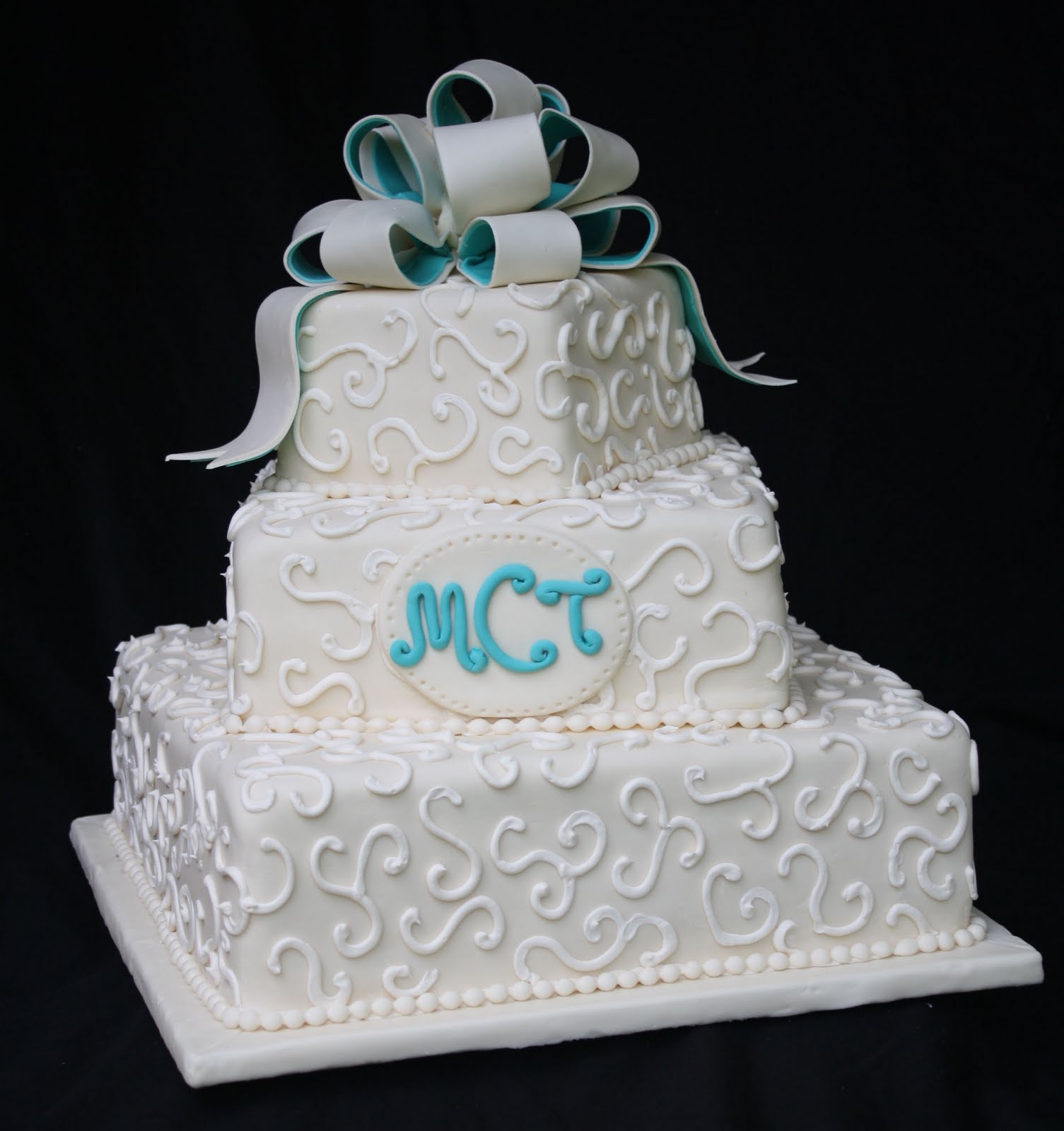 An Ivory and Teal Wedding  Cake 