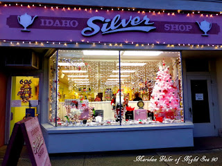A peek at my town during Christmas; I like this window display but I'm a little concerned about the damage the infection of elves can cause. At least Santa is there to keep the elves from getting away with too much mischief before Christmas.