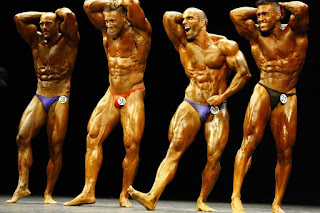 Body builders posing during a bodybuilding competition