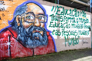A street art mural of Paulo Friere, a Brazilian educator and philospher