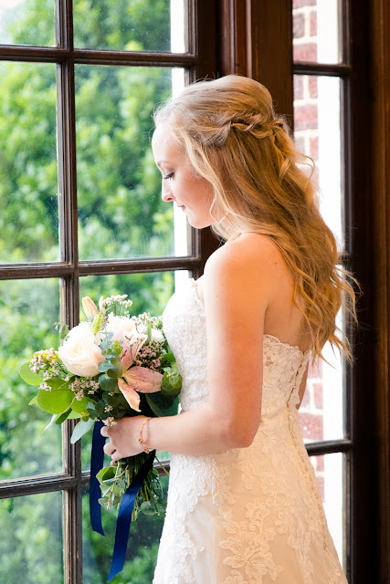 The bride and groom met in college, and have been together for three and a half years.  Maggie said that walking down the aisle towards Jordan was the best part of the day, knowing that they were surrounded by the love and support of friends and family.  She said, "As I walked towards him, Jordan and I were both tearing up and we couldn't look away from each other."  Jordan said that since he was "anxious all day, to the point of feeling sick," the first look was the most memorable part of the day.  He said, "The moment I saw Maggie, I felt 100% relieved, and it made the hours before the ceremony so much more enjoyable."    The Festivities Event Center in El Reno, OK, was the perfect wedding backdrop, with 10' windows, a whole second floor to get ready in, and a romantic setting for the outdoor nuptial.  The bride looked "drop-dead gorgeous" in her lace-embroidered, strapless, wedding gown, followed by her bridesmaids, dressed in individually designed gowns in soft hues of dusty rose.  Each bridesmaid had a spring floral bouquet, similar to the bride's bouquet of pastel pink roses and lilies.    After the couple exchanged wedding vows, pictures of the family and wedding party were taken, and it was time to celebrate!  First dances came next, then guests were invited to enjoy a Mexican buffet.  Dessert included the gorgeous wedding cake, chocolate groom's cake, and assorted, homemade cookies and pastries.  The evening came to a close as the guests sent the star-gazed couple off with sparklers!  The newly married couple escaped to Cozumel and Yucatan Progreso for their honeymoon.  