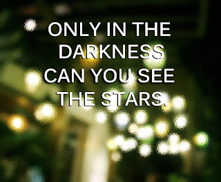 photo of blurred stars at night with a quote about hope, Only in the darkness can you see the stars