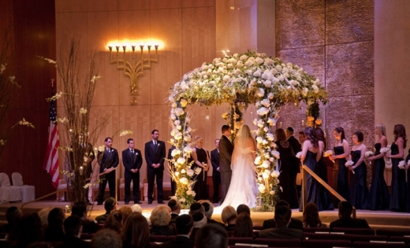 The parents remain standing under the Chuppah throughout the wedding 