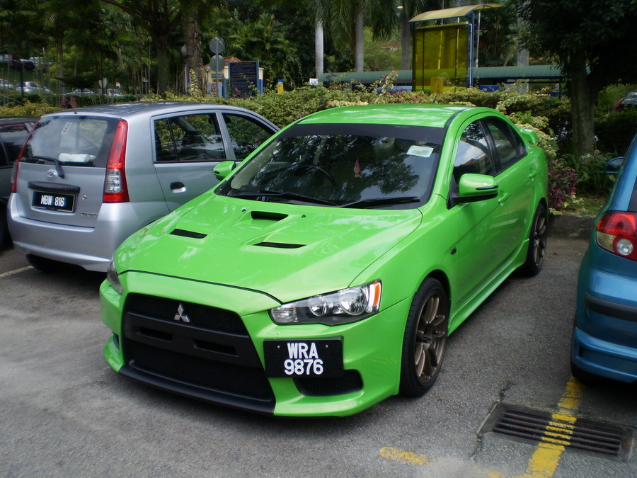 Here is a modified Mitsubishi Lancer with Evo X front bumper and bonnet