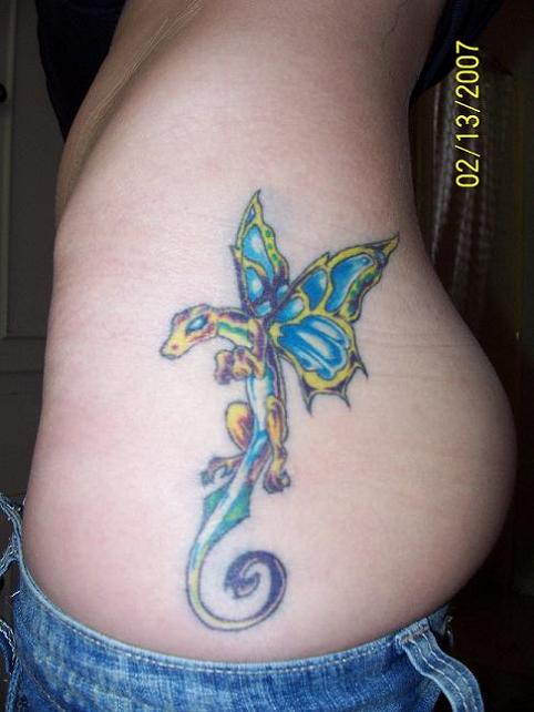 Blue rising dragon with wings tattoo.