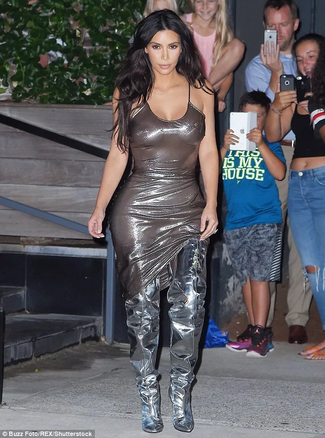 Kim Kardashian goes braless in sheer metallic dress in NYC