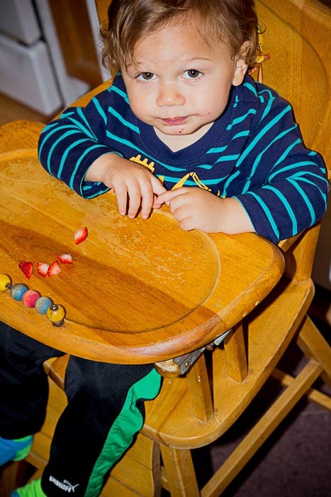 Charile eating in highchair